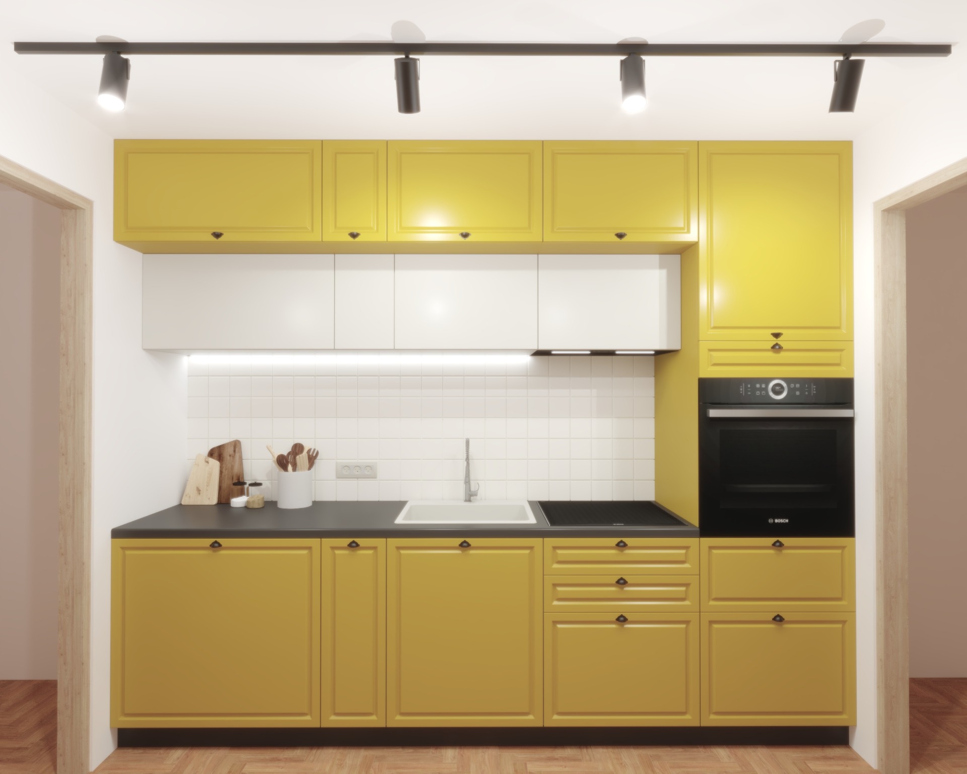 Żółta kuchnia na wymiar z czarnym blatem, białymi górnymi szafkami i sprzętem AGD marki Bosch, oświetlona szynoprzewodem.