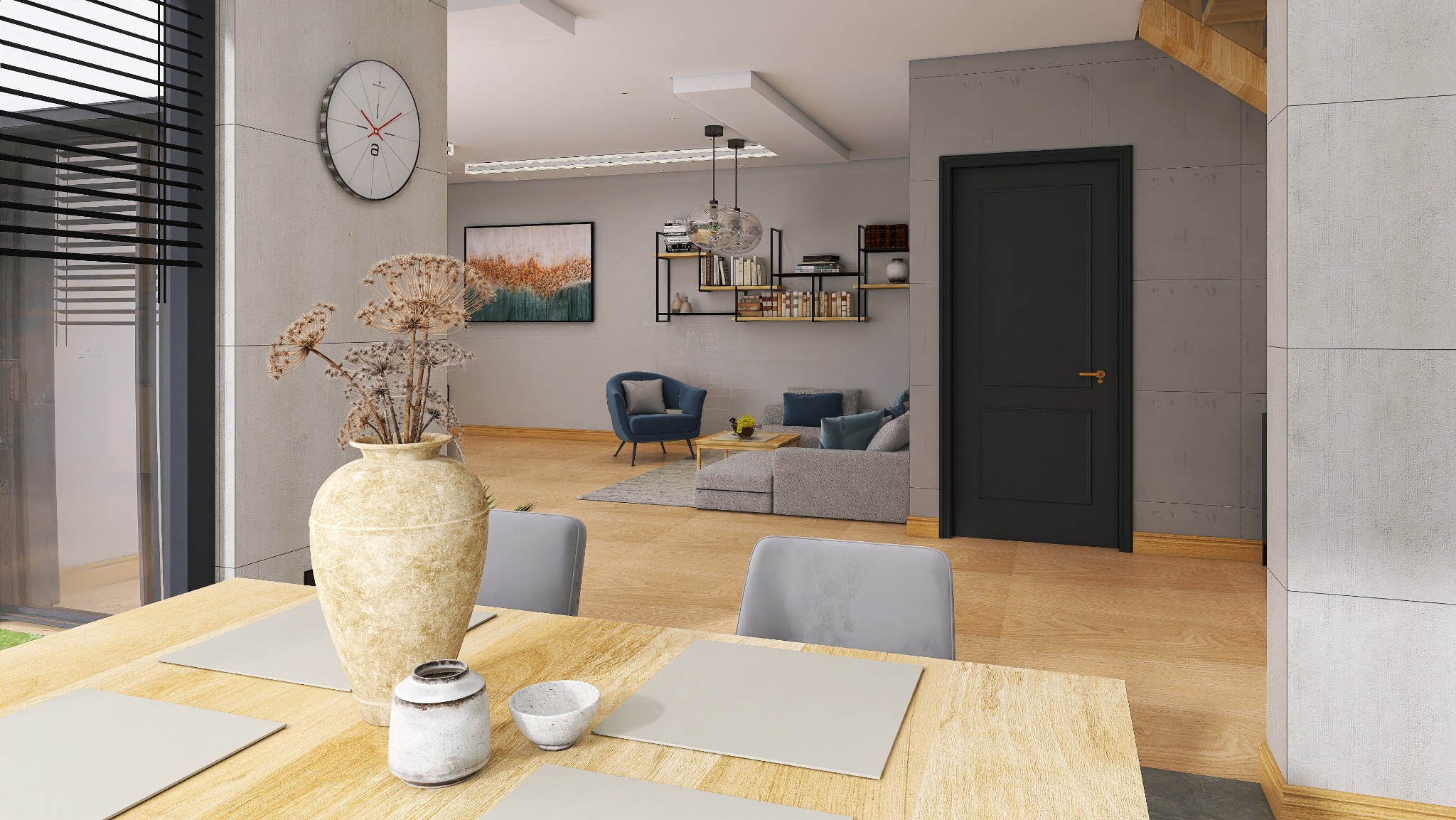 Jasne wnętrze z drewnianym stołem, dekoracyjnym wazonem z suszem i widokiem na salon z szarą sofą oraz niebieskim fotelem. Nowoczesny design, neutralna kolorystyka.