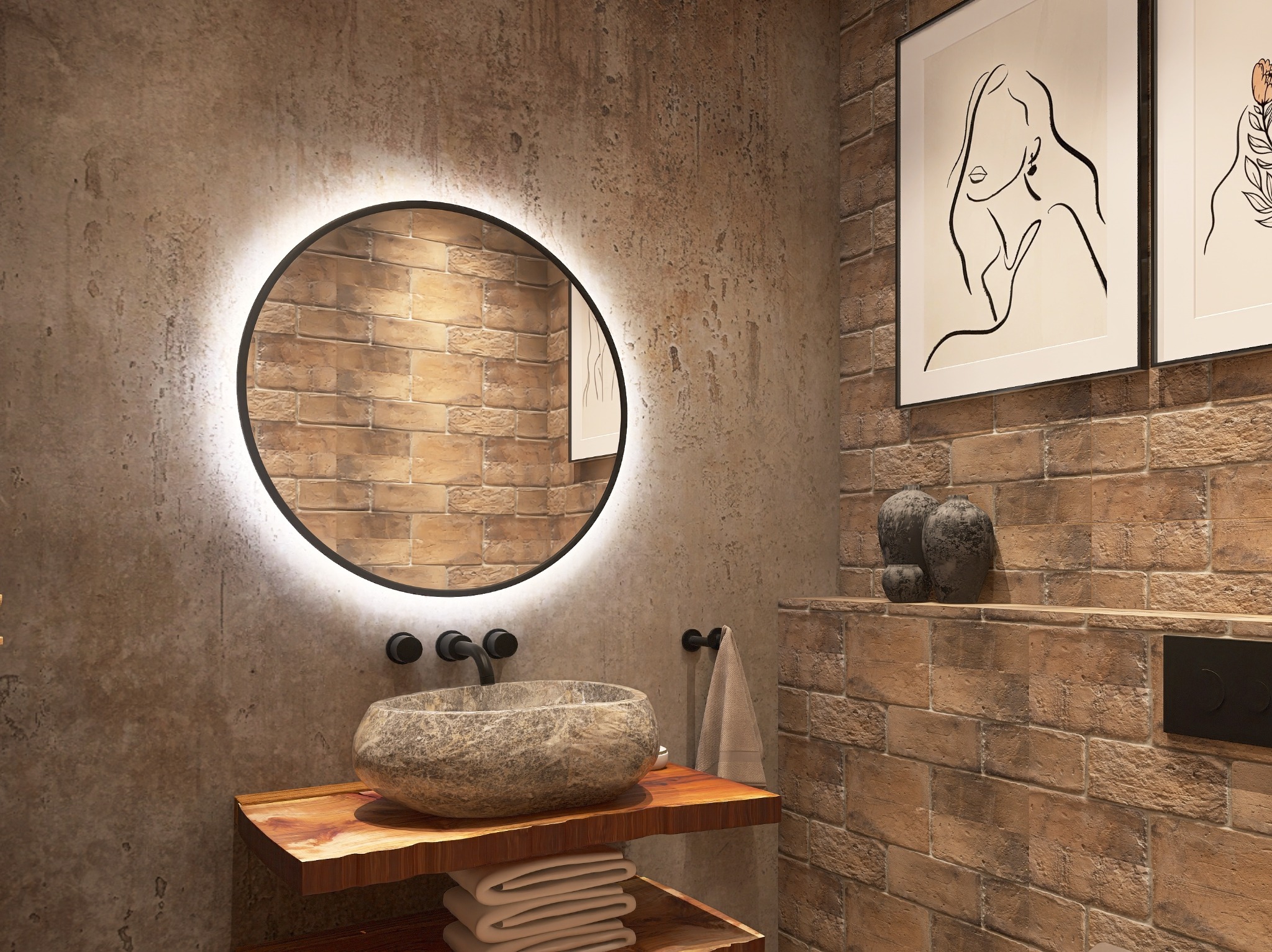 Nowoczesna łazienka z okrągłym lustrem LED, kamienną umywalką na drewnianym blacie i ceglaną ścianą. Dwa obrazy w czarnych ramach dodają elegancji.
