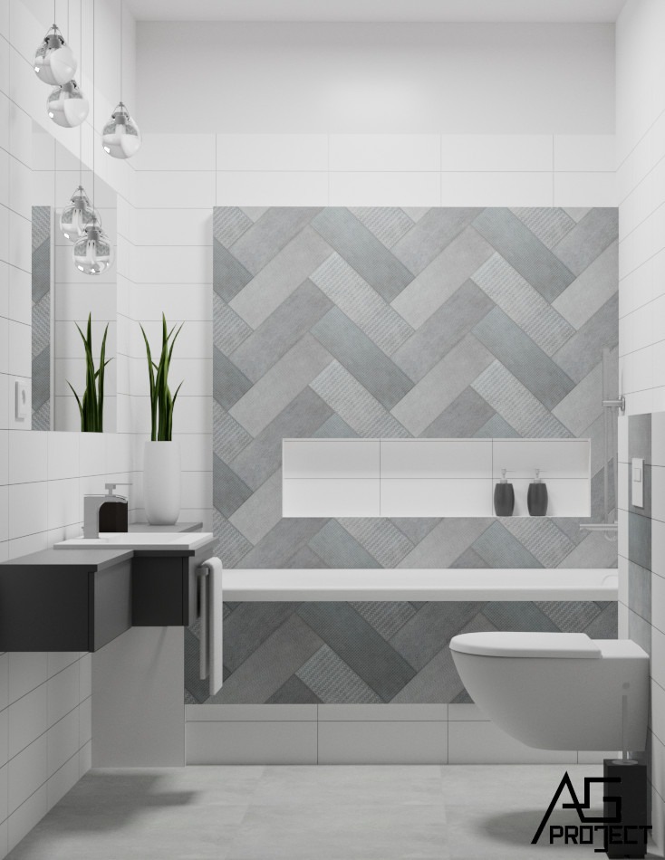 Nowoczesna łazienka w bieli i szarości z akcentem w postaci ściany z płytek ułożonych w jodełkę, wisząca toaleta i czarna umywalka.