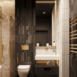 Perfect- bud Malgorzata Brylowska - Nowoczesna łazienka z kabiną prysznicową, umywalką na szafce i toaletą w zabudowie. Ciemne płytki na ścianie kontrastują z jasnymi, pionowymi płytkami.