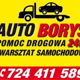 Żółto-czerwony szyld reklamowy firmy Auto Borys z czarną grafiką lawety z samochodem, napisem 'Pomoc Drogowa 24h' i numerem telefonu.