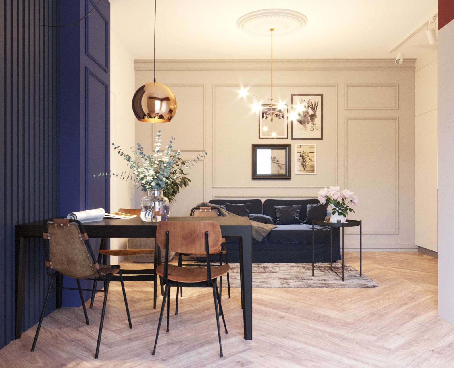 Jasne wnętrze mieszkania z parkietem w jodełkę, ciemną sofą, stołem z krzesłami, dekoracyjnym oświetleniem i ścianami w odcieniach beżu i granatu.
