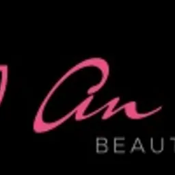 Logo salonu kosmetycznego z różowym kwiatem lotosu i napisem 'An Beauty Expert' na czarnym tle.