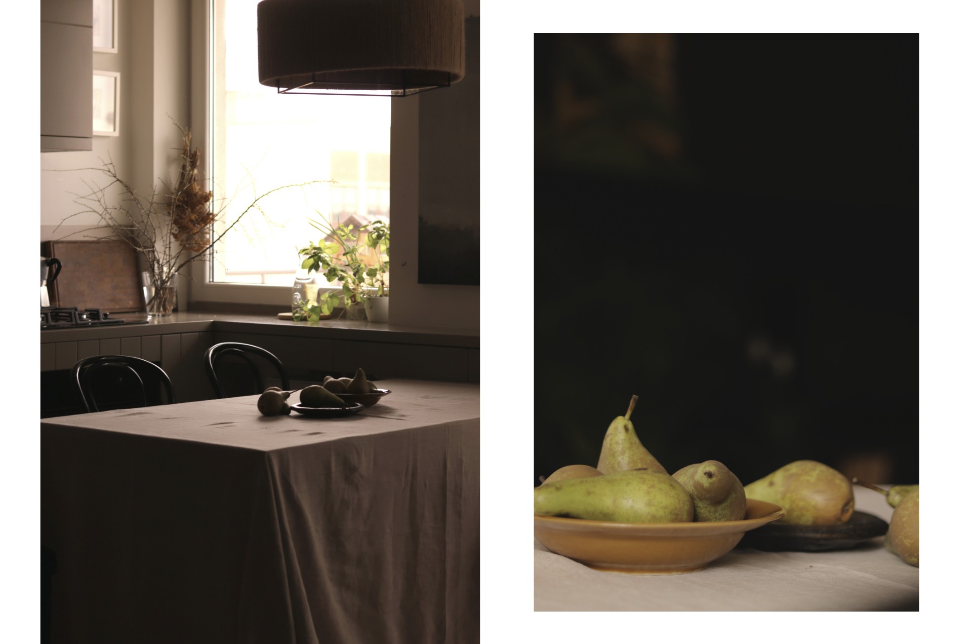 Kuchnia w stonowanych kolorach z blatem nakrytym beżowym obrusem, na którym leżą gruszki w ceramicznych misach, w tle okno z roślinami i gałązkami w wazonie.