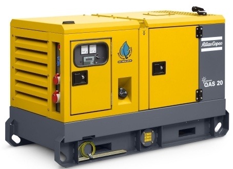 Żółto-szary agregat prądotwórczy Atlas Copco QAS 20, widok z boku, z widocznymi gniazdami, wskaźnikami i logo producenta.