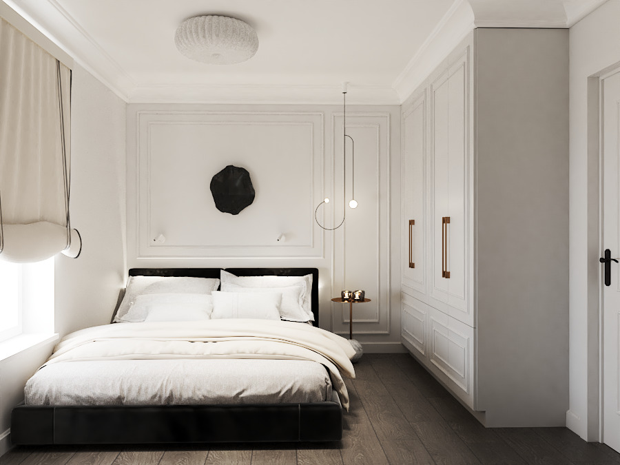 Elegancka sypialnia w bieli z czarnymi akcentami: łóżko, abstrakcyjna dekoracja ścienna, minimalistyczna lampa i szafa w zabudowie z długimi, smukłymi uchwytami.