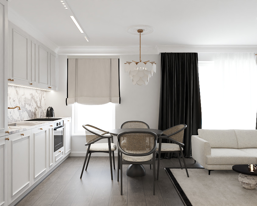 Jasne wnętrze: biała kuchnia z marmurowym blatem, okrągły stół z krzesłami z rattanu, sofa i czarne zasłony. Nowoczesny design z elementami klasycznymi.