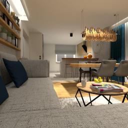 Roksana Chrobak Interiors - Wizualizacja salonu z aneksem kuchennym, szara sofa z granatowymi poduszkami na pierwszym planie, drewniane półki z dekoracjami, stół jadalny z krzesłami i lampą wiszącą o organicznym kształcie...