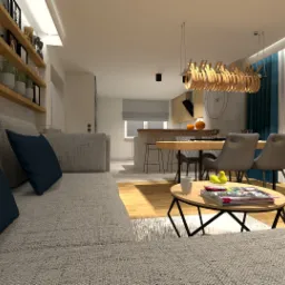 Wizualizacja salonu z aneksem kuchennym, szara sofa z granatowymi poduszkami na pierwszym planie, drewniane półki z dekoracjami, stół jadalny z krzesłami i lampą wiszącą o organicznym kształcie...