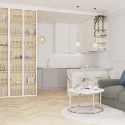 Wnętrze salonu z aneksem kuchennym: przeszklona witryna z dekoracyjnymi przedmiotami, marmurowy barek, szara sofa z niebieskimi poduszkami, parkiet w jodełkę.