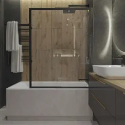 Nowoczesna łazienka z pralką w odcieniach szarości, drewna i bieli. Umywalka nablatowa, podświetlane lustro, kabina prysznicowa z czarną ramą i grzejnik drabinkowy z ręcznikami.