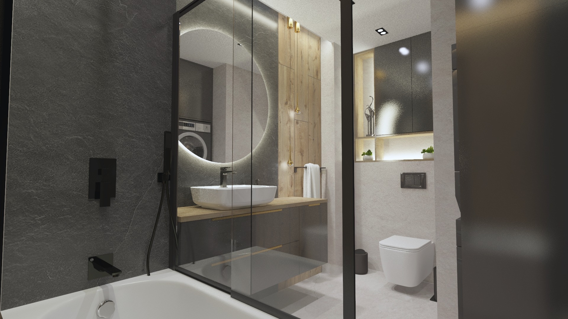 Nowoczesna łazienka z szarą ścianą, okrągłym lustrem z podświetleniem LED, białą umywalką na drewnianym blacie, kabiną prysznicową typu walk-in, toaletą podwieszaną i pralką w tle.