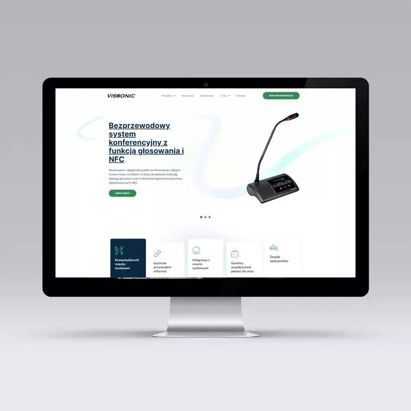Monitor wyświetlający stronę internetową z bezprzewodowym systemem konferencyjnym z funkcją głosowania i NFC, na minimalistycznym tle.