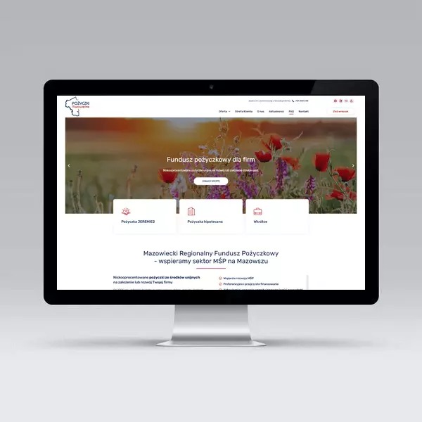 Ekran komputera stacjonarnego wyświetlający stronę internetową Mazowieckiego Regionalnego Funduszu Pożyczkowego z motywem polnych kwiatów w nagłówku i hasłem 'Fundusz pożyczkowy dla firm'.