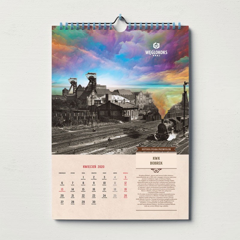 Kalendarz ścienny z ilustracją przedstawiającą krajobraz przemysłowy z kopalnią i parowozem, stylizowany na starą fotografię z kolorowym, abstrakcyjnym niebem, logo Węglokoks Kraj, miesiąc kwiecień...