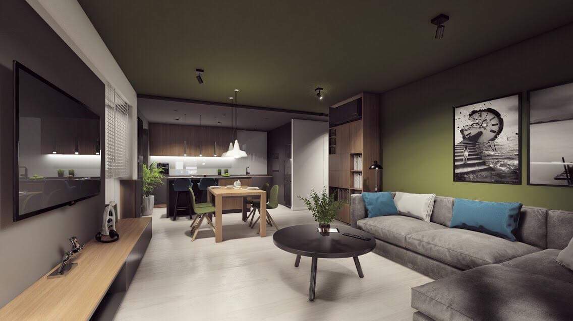 Nowoczesne wnętrze mieszkania z otwartą kuchnią, szarym narożnikiem z błękitnymi poduszkami, okrągłym stolikiem kawowym i drewnianym stołem jadalnym, oświetlone punktowo.