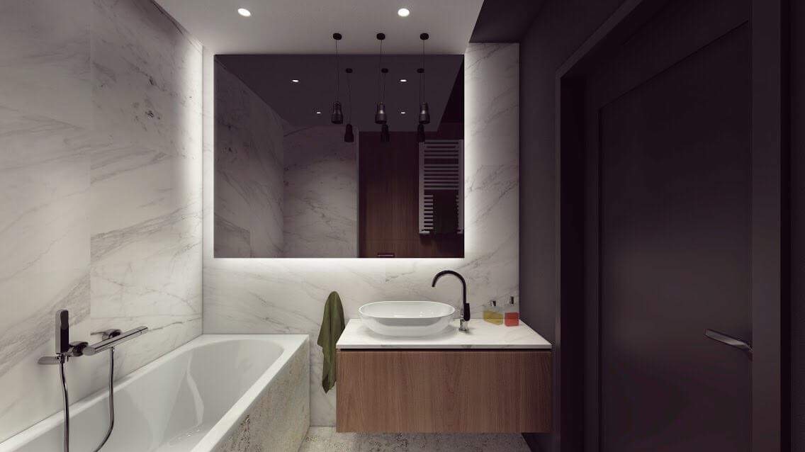Nowoczesna łazienka z marmurowymi ścianami, podświetlanym lustrem, wiszącą szafką z umywalką i czarną armaturą, widoczne odbicie grzejnika.