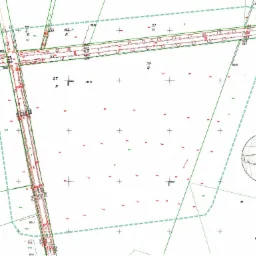 Mapa geodezyjna działki z naniesionymi punktami pomiarowymi, drogami i granicami, widoczny fragment planu sytuacyjnego w prawym dolnym rogu.