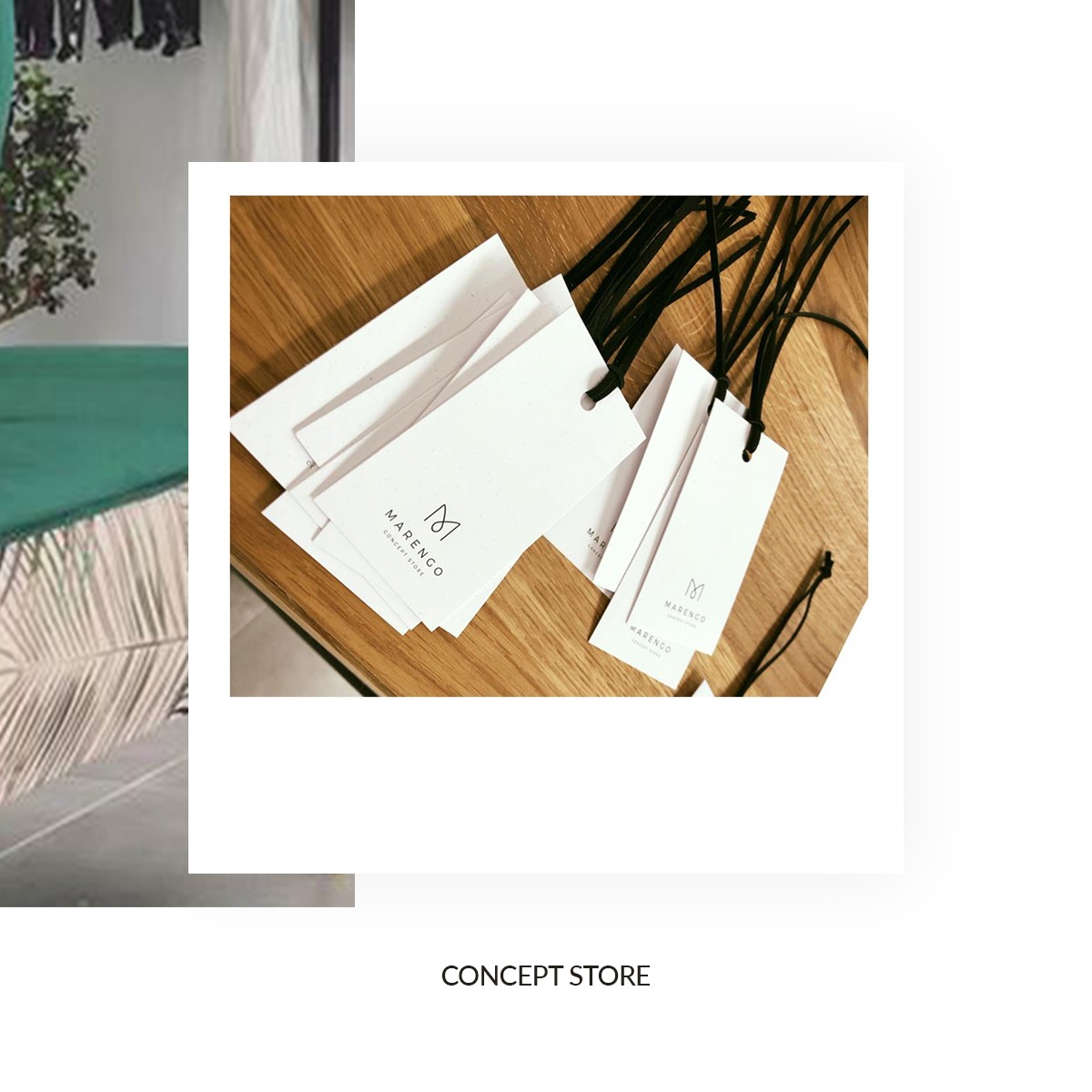 Stos białych metek z logo Marengo Concept Store leżący na drewnianym blacie, czarne sznurki metek rozłożone wokół.