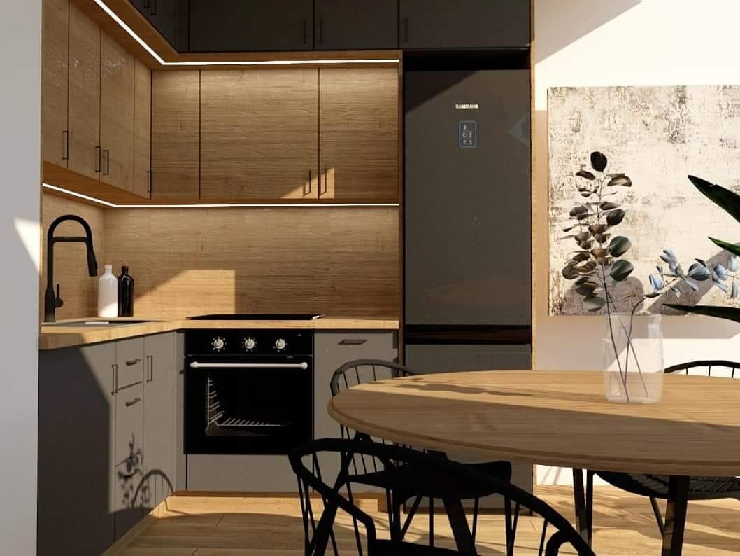 Wizualizacja nowoczesnej kuchni z drewnianymi frontami szafek podświetlonymi listwą LED, szarymi szafkami dolnymi, czarnym piekarnikiem i lodówką Samsung. Na pierwszym planie okrągły drewniany stół...
