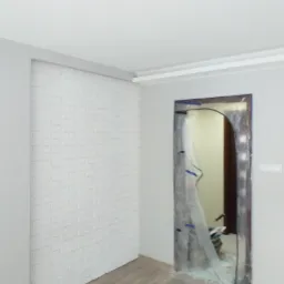 Wnętrze w trakcie prac wykończeniowych: ściana z białej cegły, zabezpieczone folią drzwi, panele podłogowe.