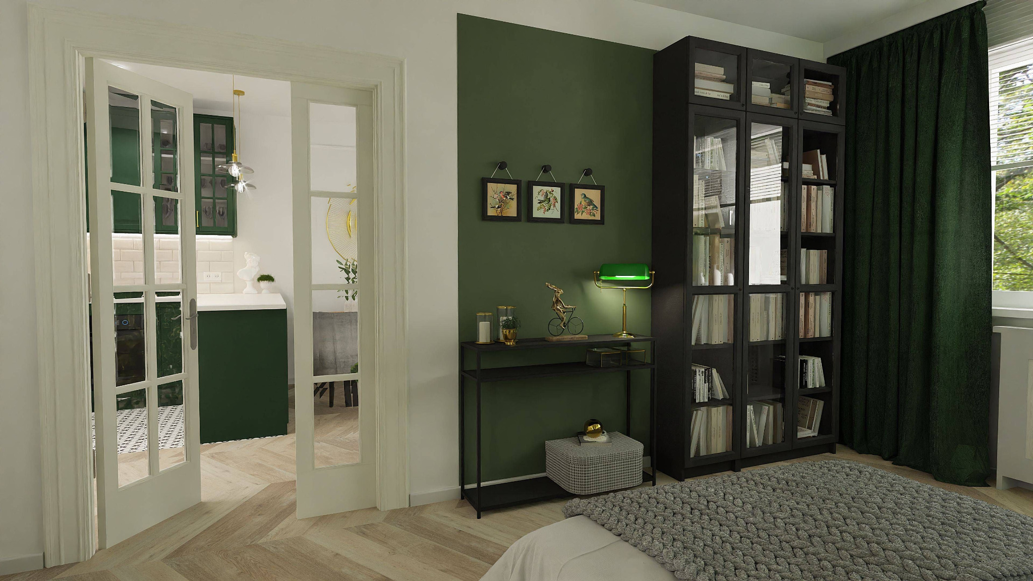 Pokój z zieloną ścianą, czarną biblioteczką i widokiem na kuchnię przez przeszklone drzwi, lampka na stoliku konsolowym.