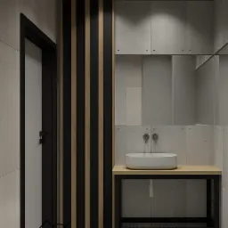 Minimalistyczna łazienka z umywalką nablatową, drewnianym blatem na czarnym metalowym stelażu, betonowymi płytkami i dekoracyjnymi panelami z drewna i czerni.