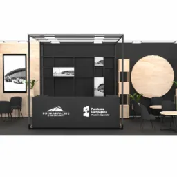 Wizualizacja stoiska targowego z elementami drewna i czerni, zawierająca recepcję z logo Podkarpackie, stoliki kawowe z krzesłami i roślinami doniczkowymi, oraz grafiki lotniska w tle.