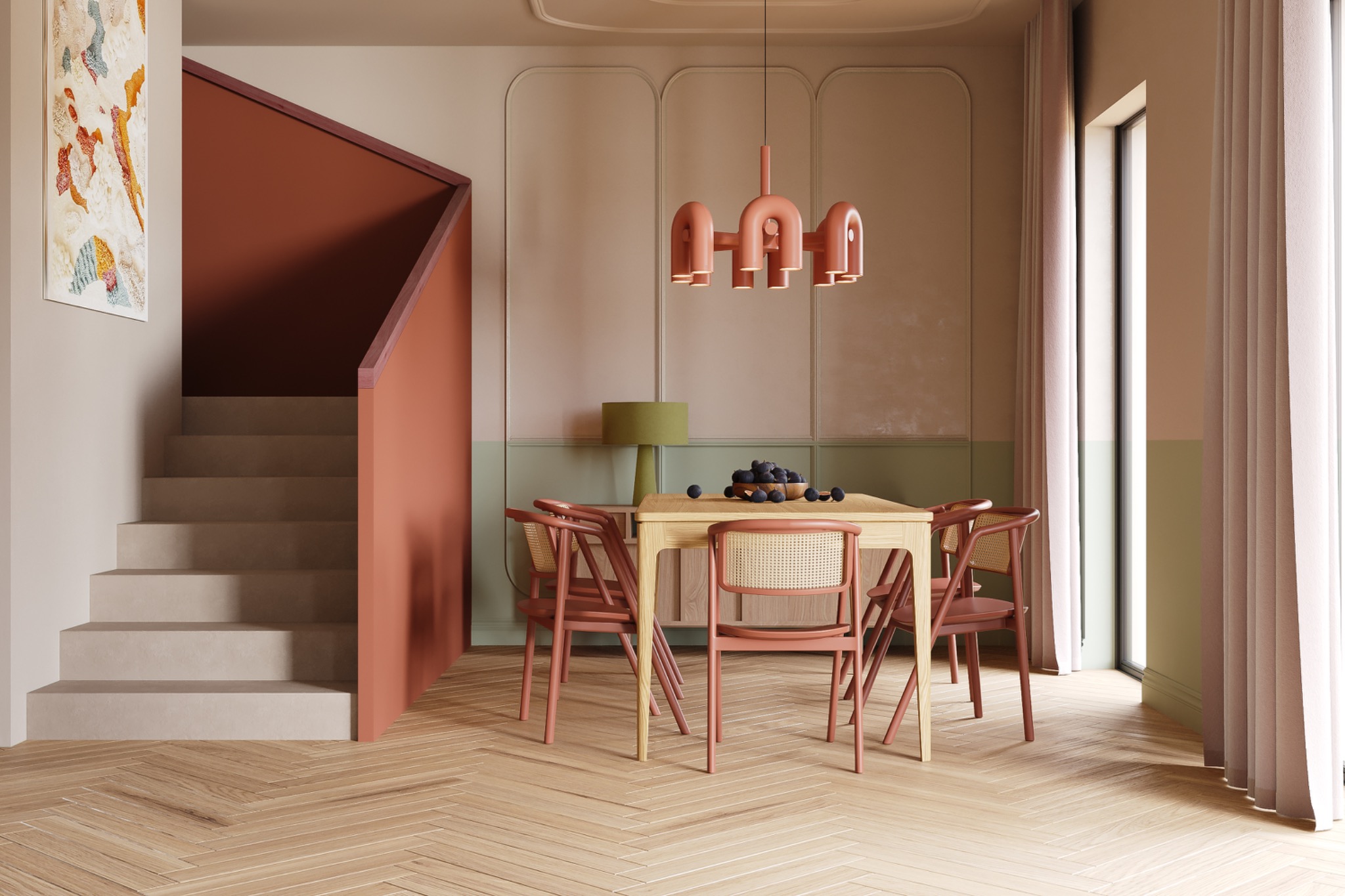 Jadalnia w pastelowych kolorach z drewnianym parkietem ułożonym w jodełkę, minimalistycznym stołem z owocami, krzesłami z rattanowymi oparciami i oryginalną lampą w kolorze terakoty.