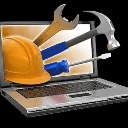 Laptop z narzędziami (klucz, młotek, śrubokręt) i kaskiem budowlanym wychodzącymi z ekranu, symbolizującymi serwis komputerowy.