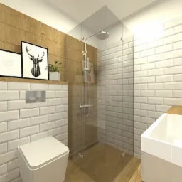 Nowoczesna łazienka z drewnianą ścianą, białymi płytkami typu metro, kabiną prysznicową ze szkła, wiszącą toaletą i umywalką nablatową, dekorowana grafikami w czarnych ramkach i rośliną w doniczce.