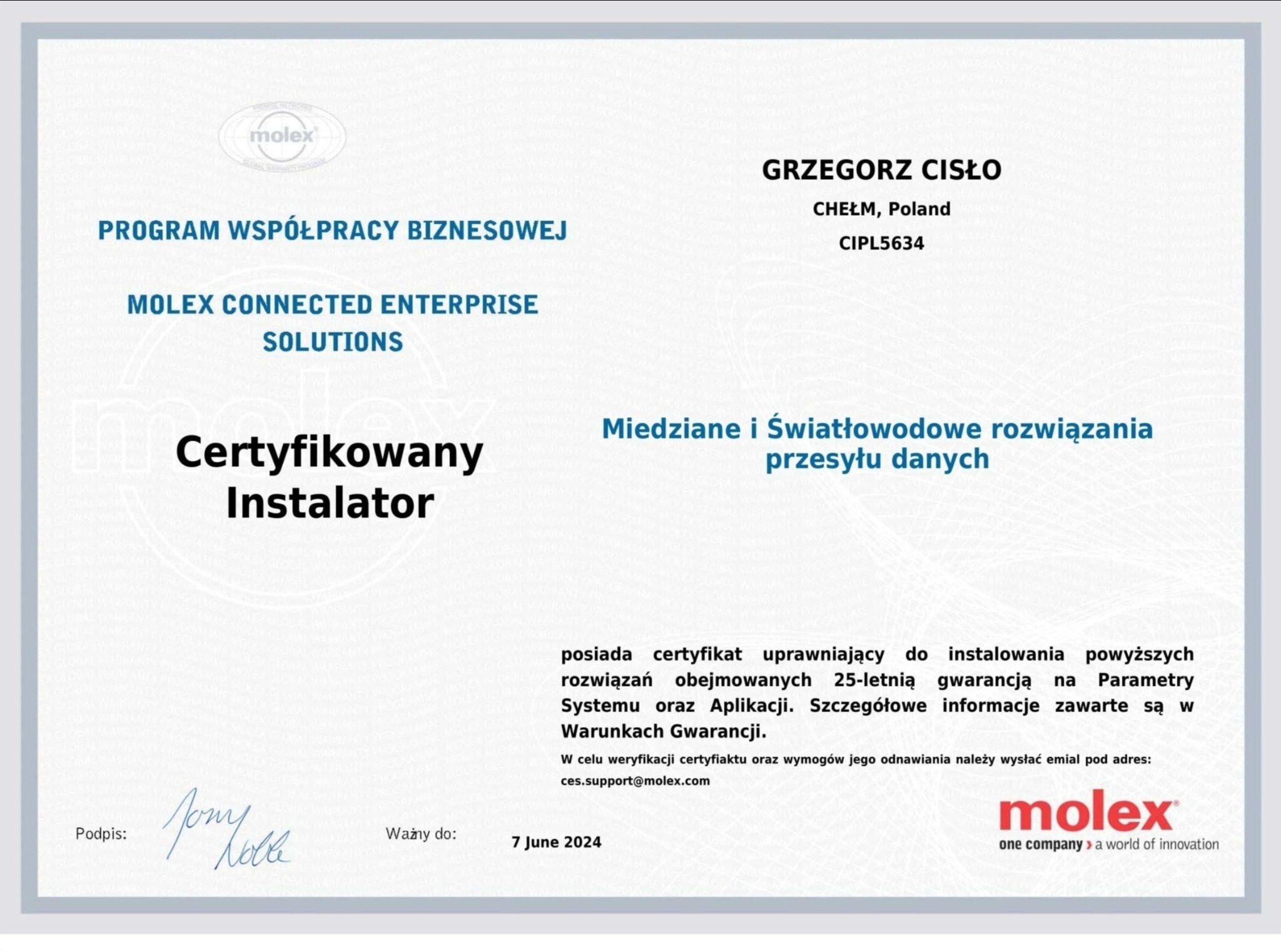 Skan certyfikatu firmy Molex dla certyfikowanego instalatora, Grzegorz Cisło z Chełma, ważny do 7 czerwca 2024, potwierdzający uprawnienia do instalowania rozwiązań miedzianych i światłowodowych.