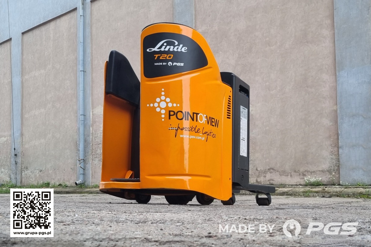 Nowy, pomarańczowy wózek paletowy elektryczny Linde T20 z logo Point of View, prezentowany na zewnątrz na betonowej nawierzchni przy szarym budynku.