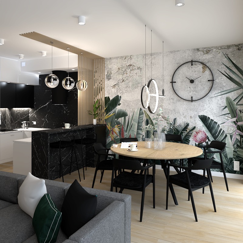 Nowoczesna jadalnia z okrągłym drewnianym stołem, czarnymi krzesłami i tapetą w tropikalne liście, oświetlona wiszącymi lampami pierścieniowymi, z widocznym fragmentem kuchni z czarnym marmurem...
