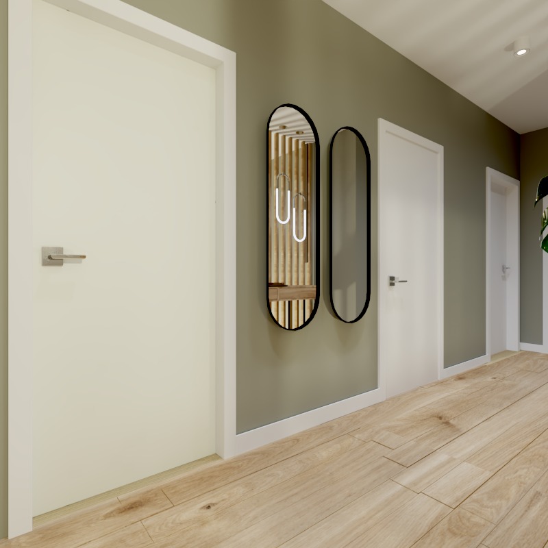 Nowoczesny przedpokój z dwiema białymi drzwiami, drewnianą podłogą i dwoma owalnymi lustrami w czarnych ramach na oliwkowej ścianie.