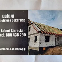 Wizytówka firmy dekarskiej z budynkiem w trakcie budowy dachu, widoczne elementy konstrukcji więźby.