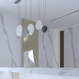 Recepcja biurowa z blatem z białego marmuru, komputerem iMac i nowoczesną lampą wiszącą z okrągłymi kloszami w odcieniach bieli i szarości.