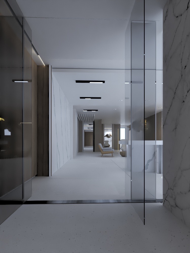 Nowoczesny korytarz biurowy z marmurowymi ścianami, szklanymi panelami i minimalistycznym oświetleniem. W tle widoczny fotel i dekoracje.