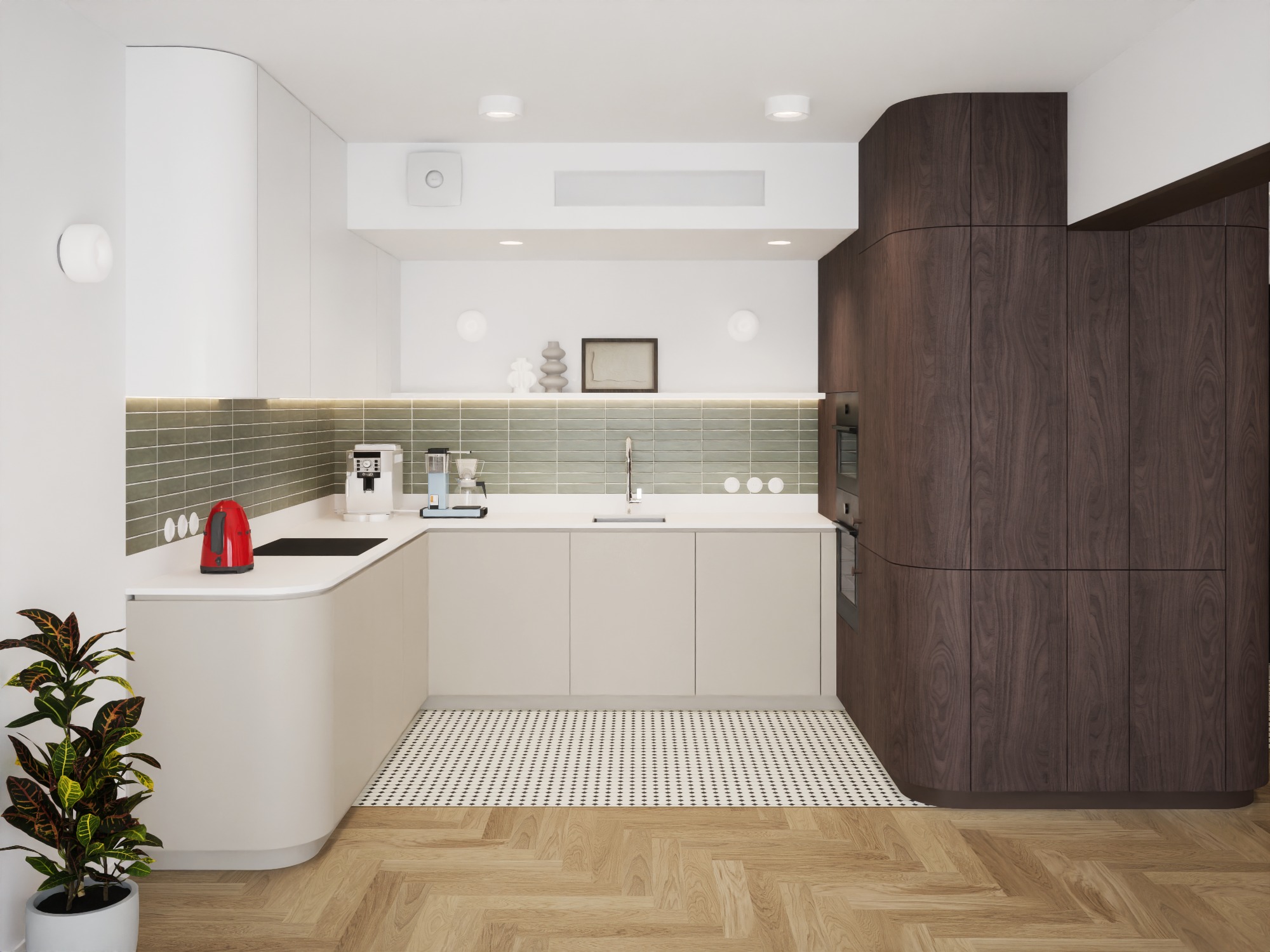 Nowoczesna kuchnia z zaokrąglonymi szafkami w kolorze kremowym i ciemnego drewna, zielone płytki nad blatem, czerwony czajnik i roślina doniczkowa w lewym dolnym rogu.