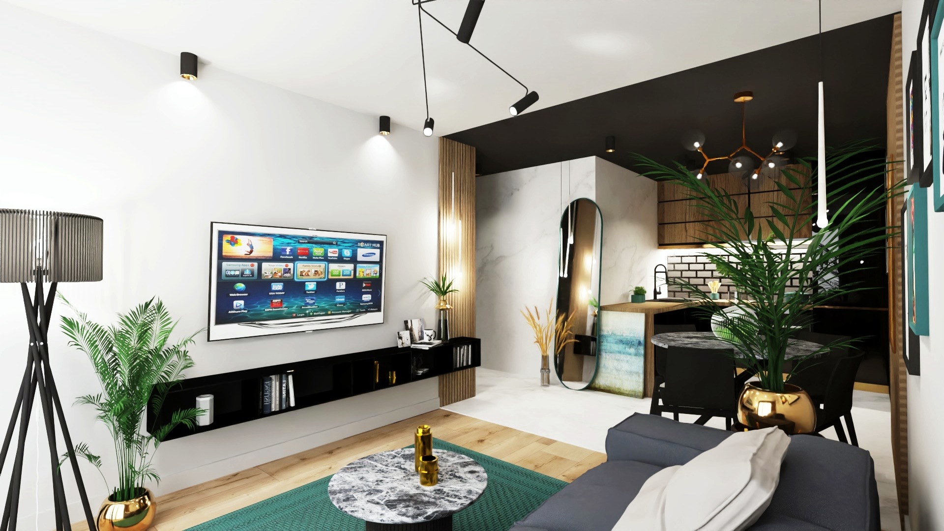 Wnętrze salonu z aneksem kuchennym w nowoczesnym stylu, z telewizorem, roślinami w złotych donicach, okrągłym stolikiem kawowym z marmurowym blatem i szarą sofą.