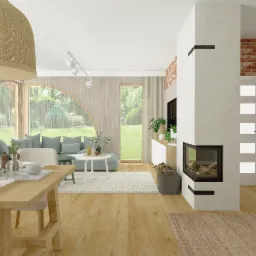 Jasny salon z drewnianym stołem jadalnym, kominkiem narożnym, ceglaną ścianą i dużym oknem z widokiem na ogród. W tle sofa w odcieniach błękitu i biały dywan.