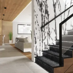 Nowoczesne wnętrze domu z podświetlanymi schodami z czarnego kamienia, szklaną balustradą i ścianą z abstrakcyjnym wzorem, widok na salon z szarą sofą i drewnianym sufitem.