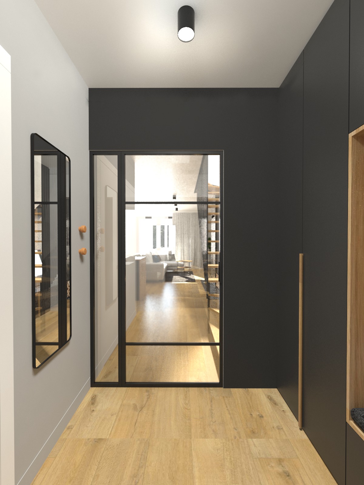 Nowoczesny hol z drewnianą podłogą, minimalistycznym lustrem z wieszakami i przeszklonymi drzwiami z czarną ramą, prowadzącymi do salonu z widocznymi schodami.