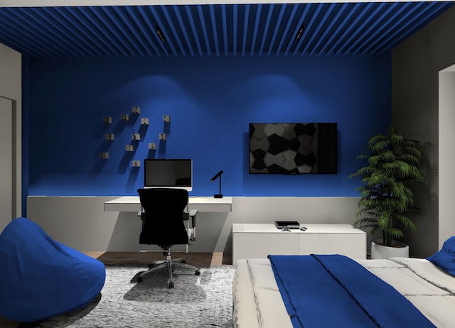 Nowoczesny pokój z niebieskimi ścianami, biurkiem z komputerem, telewizorem z geometrycznym wzorem, rośliną doniczkową i pufą w odcieniach błękitu.