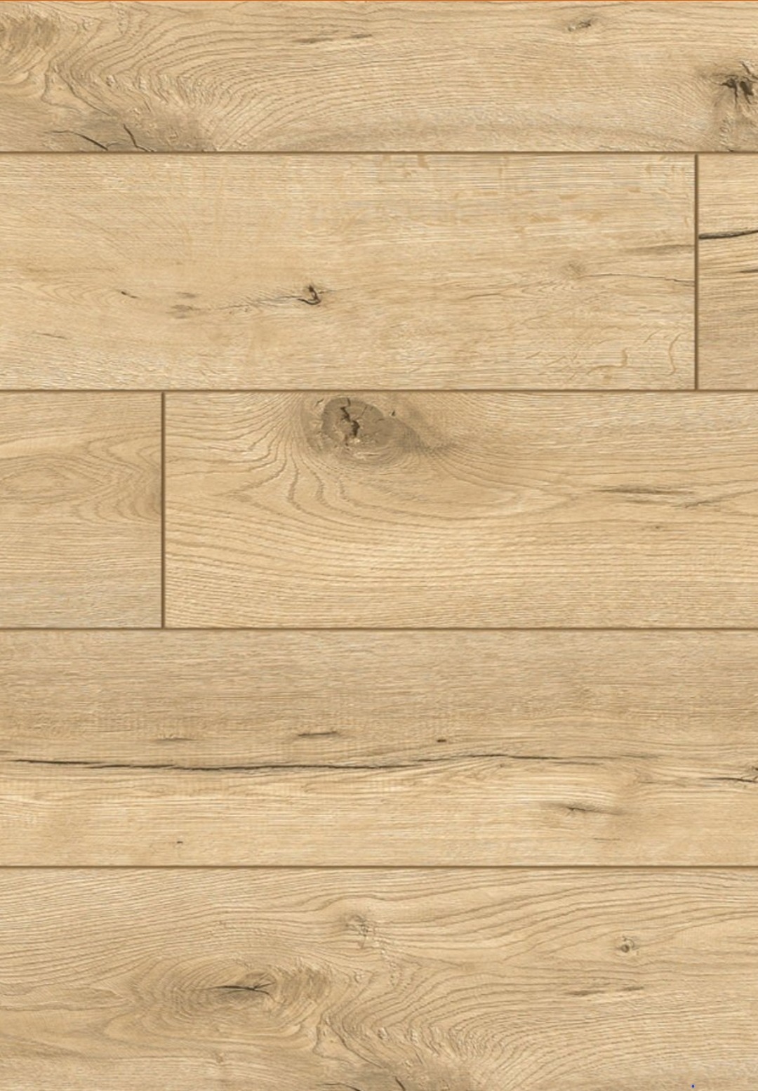 Jasne panele podłogowe z widoczną strukturą drewna i delikatnymi sękami, ułożone w regularny wzór.