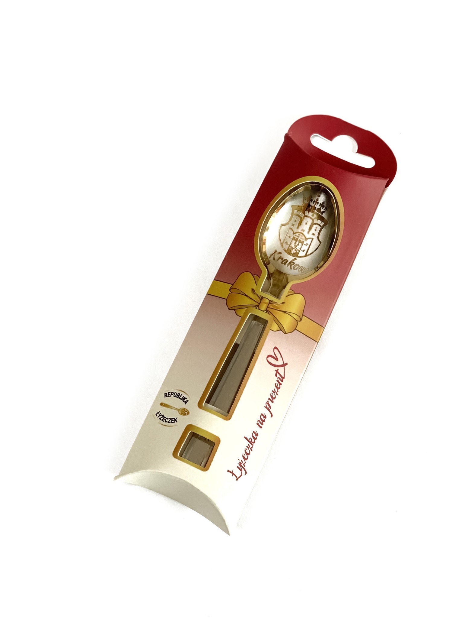 Pamiątkowa pozłacana łyżeczka z herbem Krakowa w ozdobnym opakowaniu prezentowym.