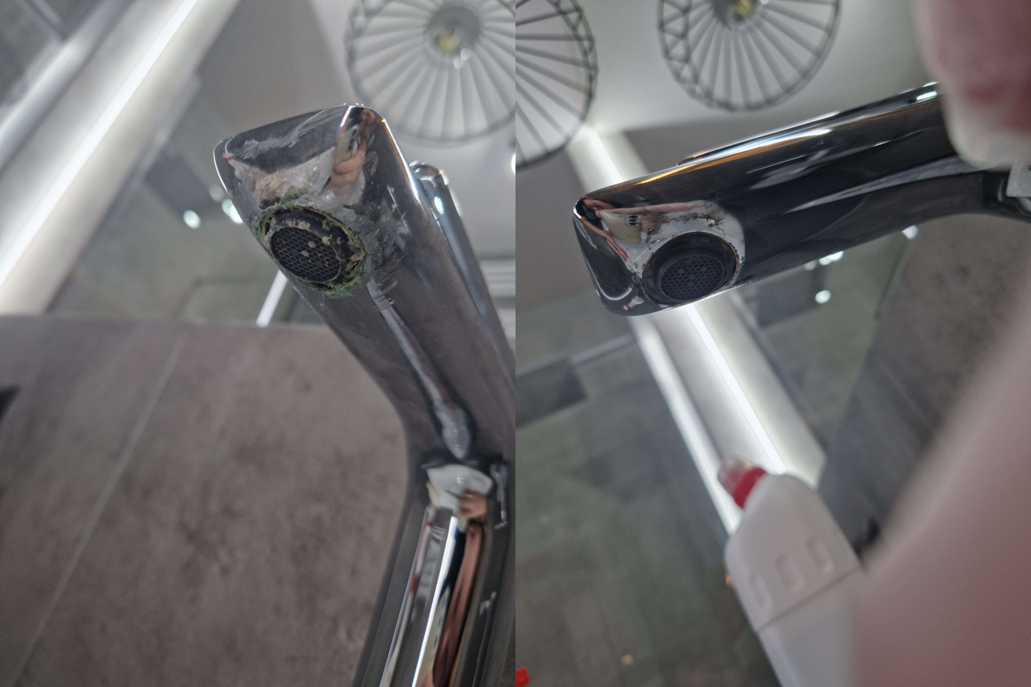 Dwa chromowane krany umywalkowe, jeden z widocznym osadem i zielonymi nalotami na sitku, drugi czysty, w tle biały sufit z okrągłymi lampami i butelka środka czyszczącego.