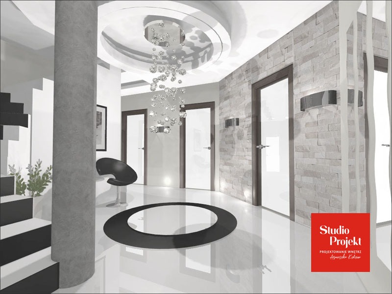 Wizualizacja wnętrza holu z kolumną, kryształowym żyrandolem, czarnym okrągłym dywanem i ścianą z kamienia dekoracyjnego.