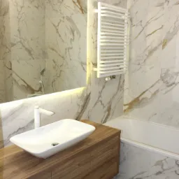 Nowoczesna łazienka z marmurowymi płytkami, umywalką nablatową na drewnianej szafce i grzejnikiem drabinkowym.